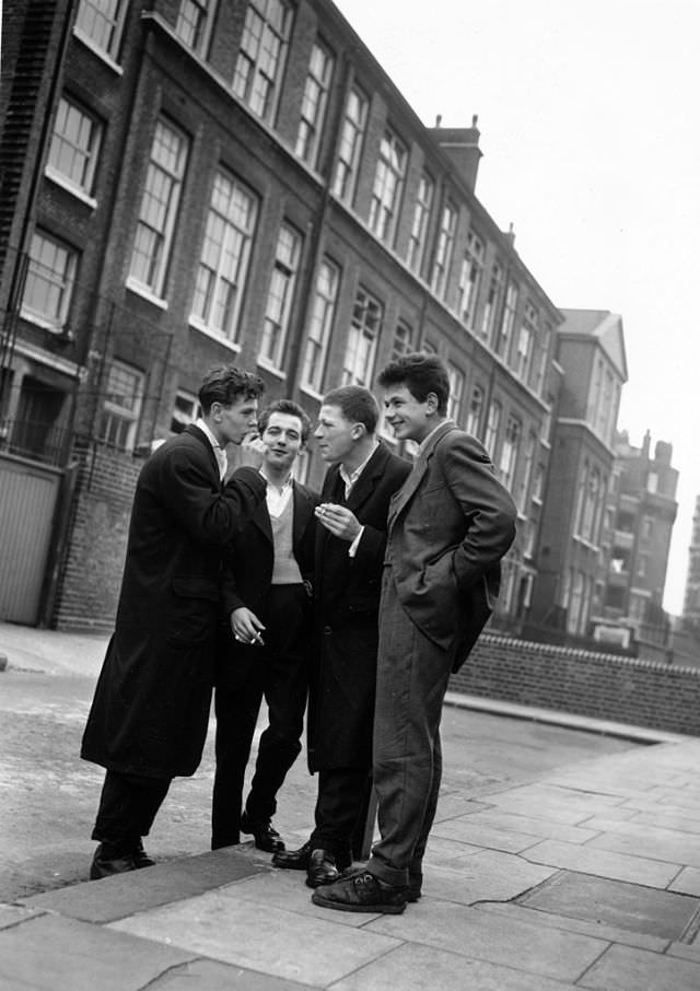 A group of rock 'n' roll fans chatting on the street, 1956.