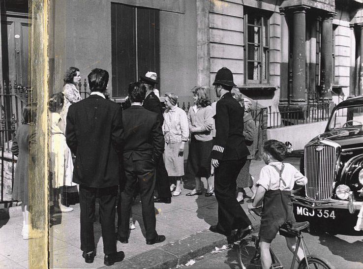 Group with policeman, Southam Street, 1956