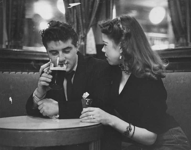A young couple in a London pub, 1954.