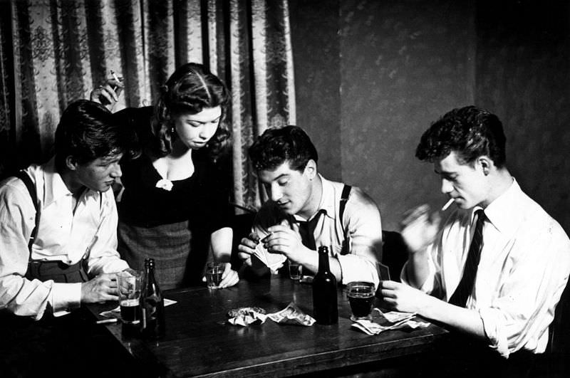 A group of young people playing cards, 1954.