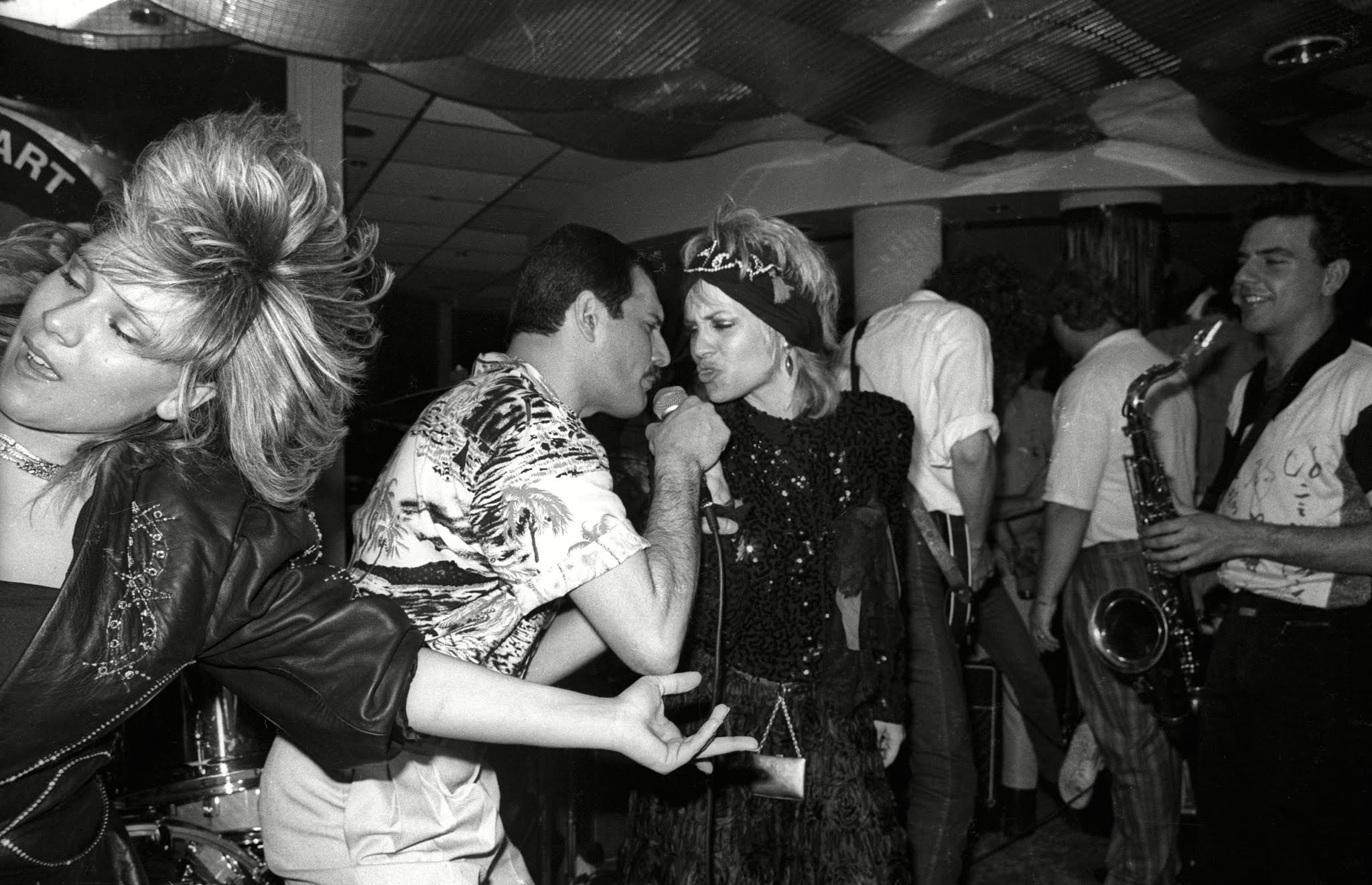 Candid Photos of Celebrities Enjoying at the Queen After-Show Party at Kensington Roof Gardens, 1986