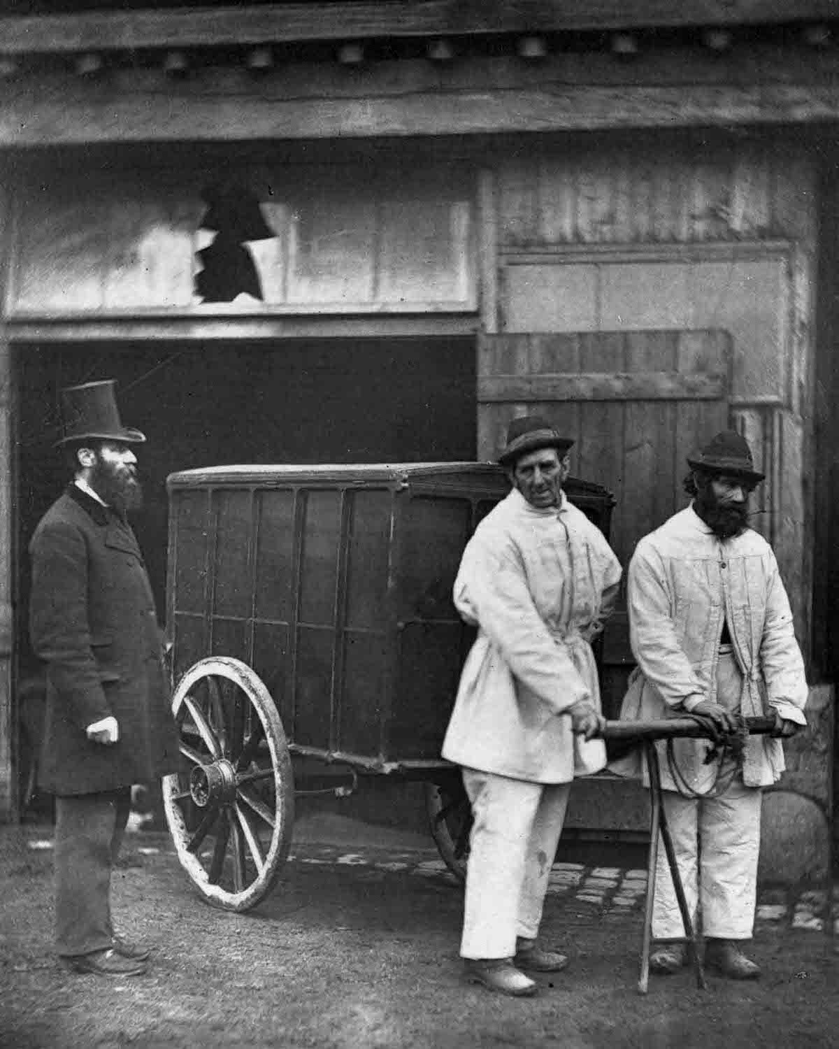 Public disinfectors sanitize the streets after an outbreak of smallpox, 1877.