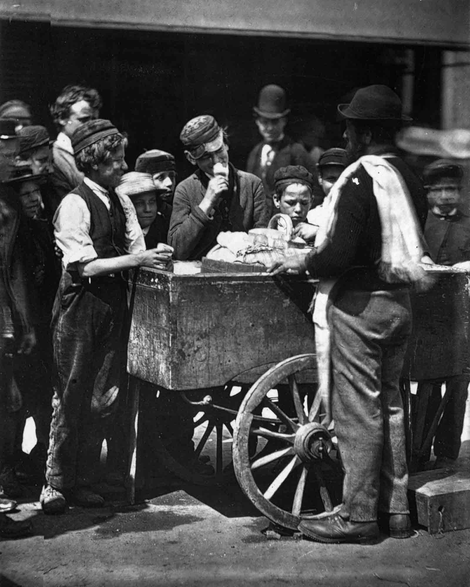 A street vendor sells halfpenny ices, 1876.