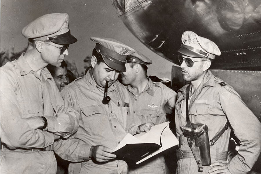 Brigadier General Lauris Norstad (left), General Curtis LeMay (center), and Brigadier General Thomas S. Power (right) reviewing a report on the firebombing of Tokyo. LeMay stated years later that he had no problem killing innocent Japanese people at the time. He was hailed as a hero and awarded nume