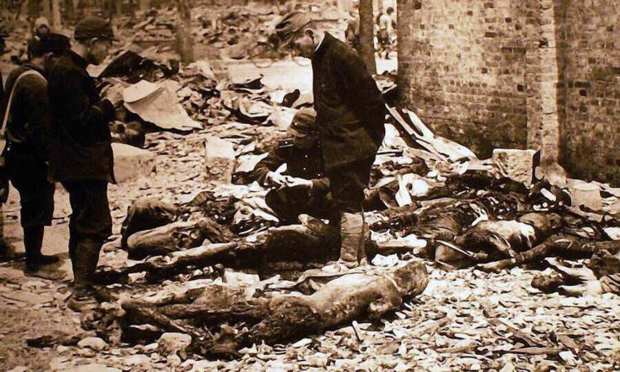 A Japanese policeman stands amidst the dead and rubble-strewn streets of Tokyo in the immediate aftermath of the capital's firebombing. March 10, 1945. Tokyo, Japan.