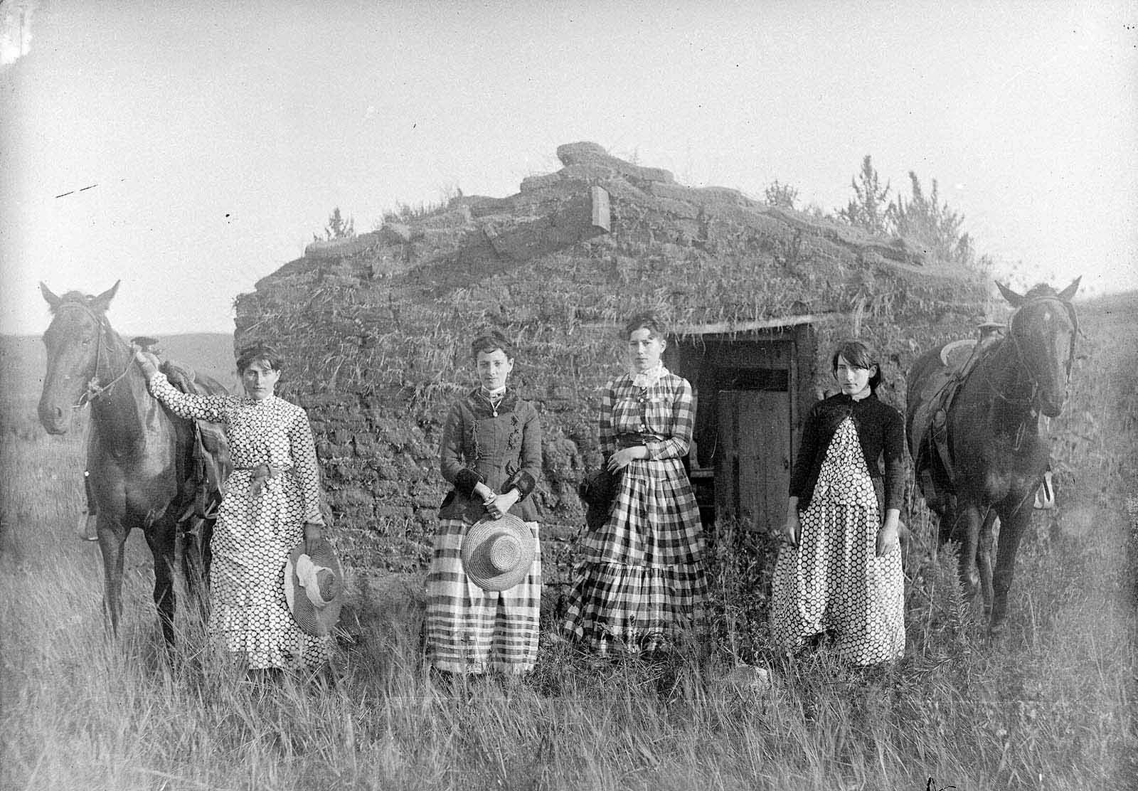 Harriet, Elizabeth, Lucie, and Ruth Chrisman at their sod house in Custer County, Nebraska, 1886.