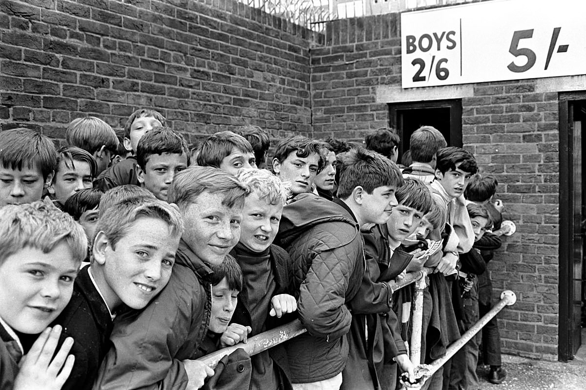Young West Ham supporters queueing outside Upton Park c.1969