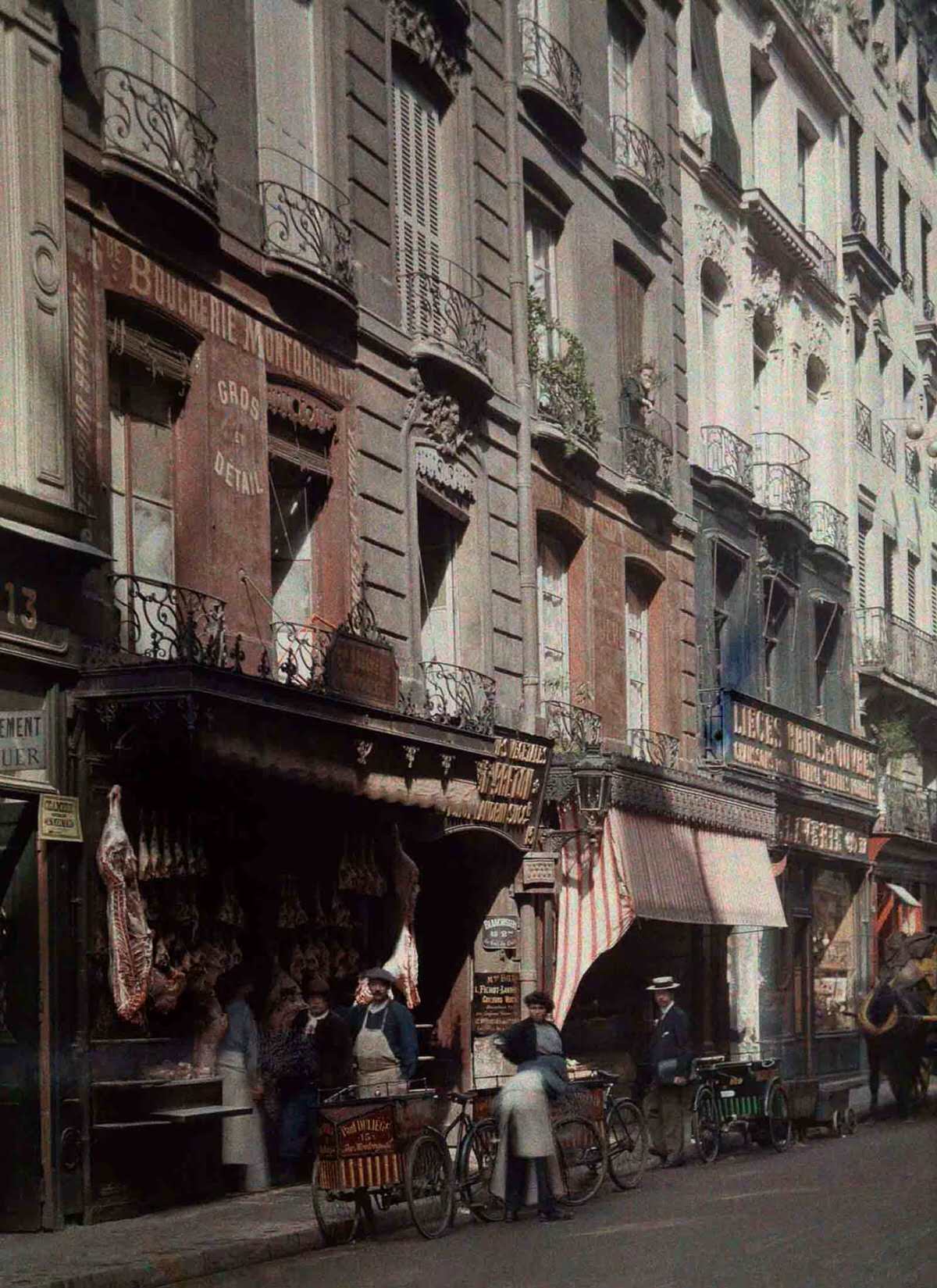 A street scene outside a butcher’s shop.