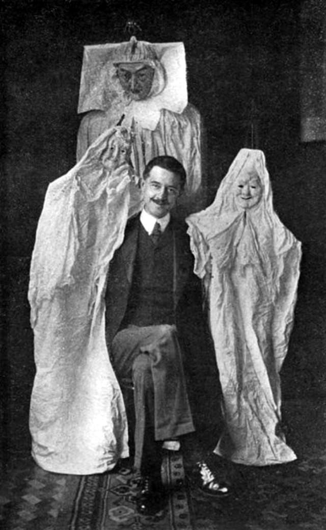 Here, Marriott with some of the “ghosts” that he bought from a catalog that sold tricks to phony spirit mediums.