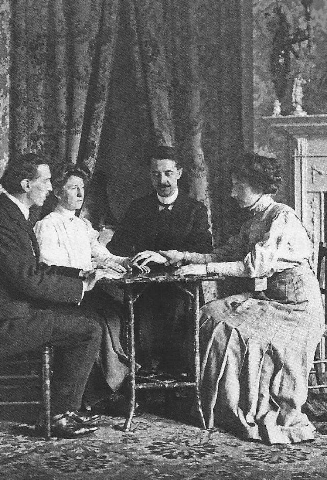 William Marriott demonstrating a fraudulent method to levitate a table.