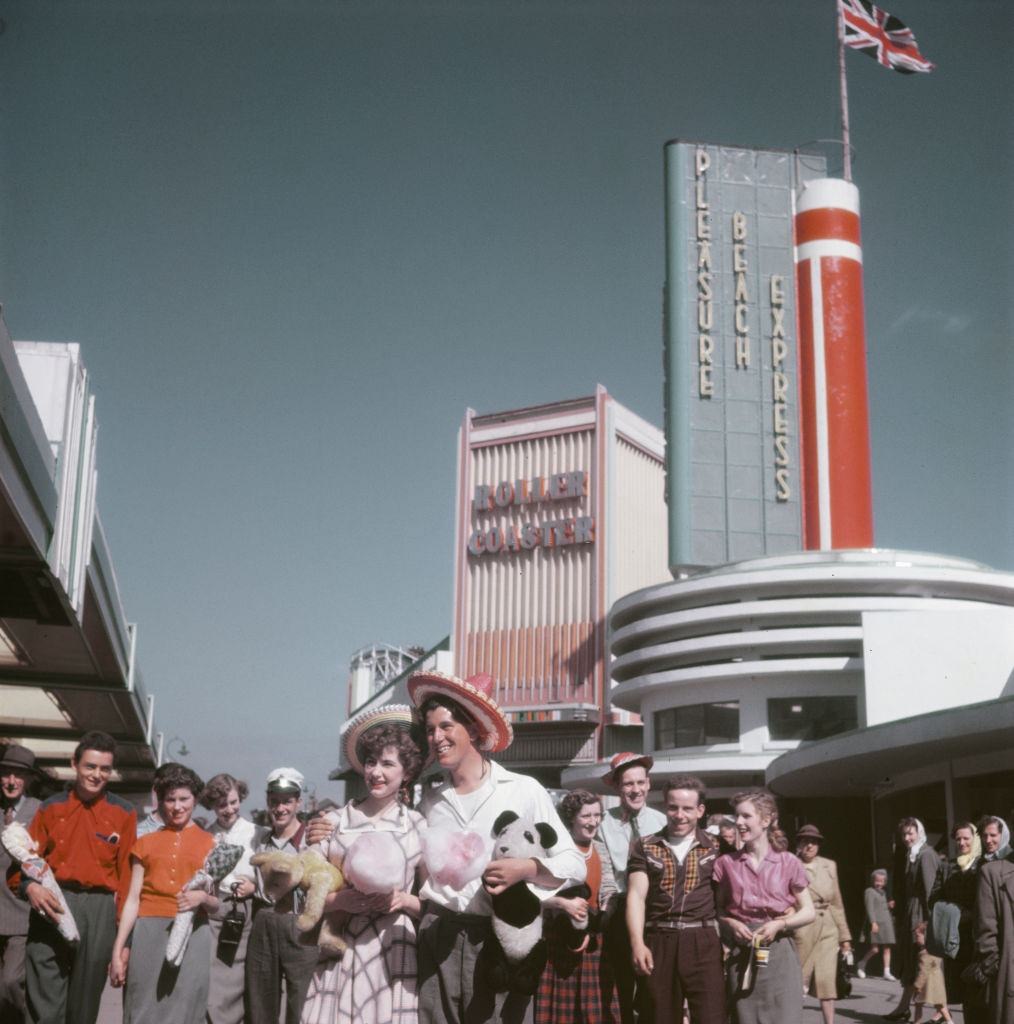 Visitors and holidaymakers enjoy a trip to Blackpool Pleasure Beach amusement park in the seaside resort of Blackpool, Lancashire in July 1952.