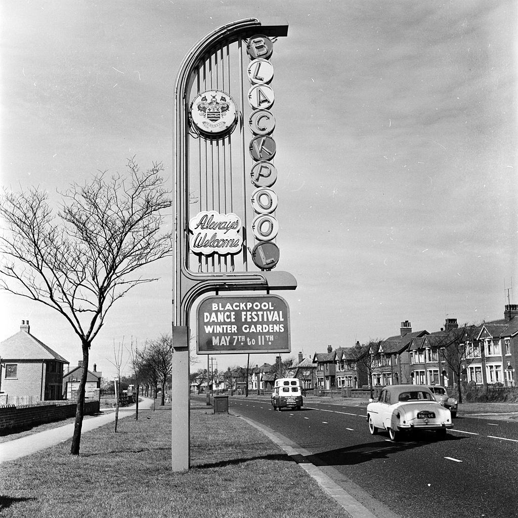 A sign welcomes visitors to a dance festival in Blackpool seaside resort, 1956.