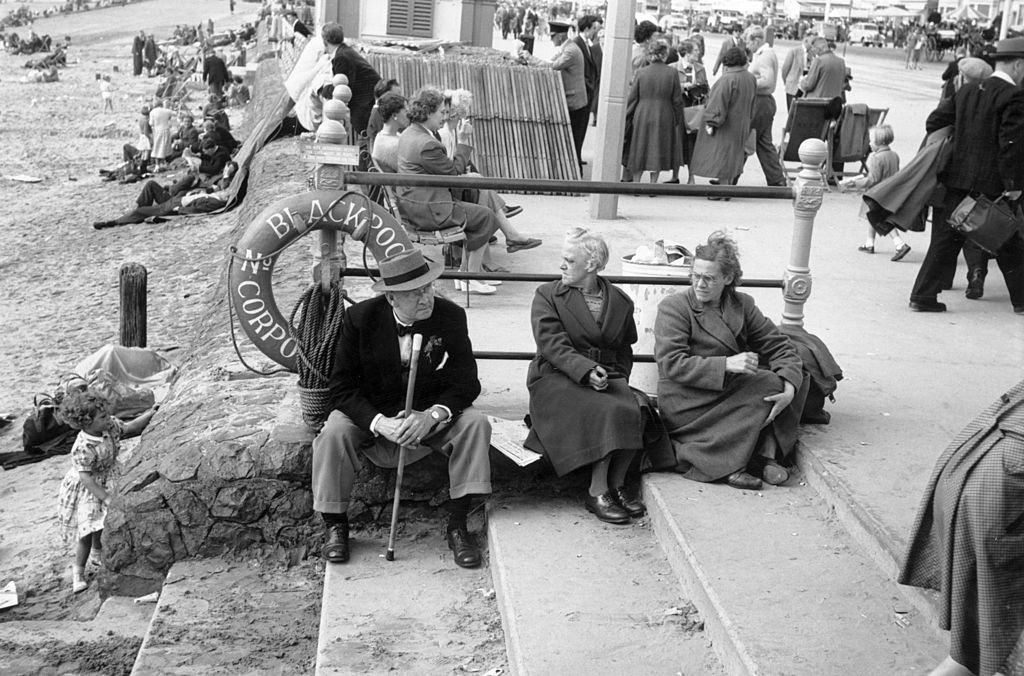 Taking advantage of the spell of good weather, holiday makers enjoy themselves on the beach at Blackpool, 1956.