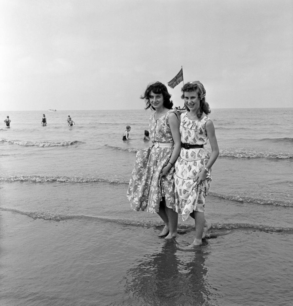 Margaret Wright and Ethel Foster of Wigan paddling in the sea at Blackpool, 1957.