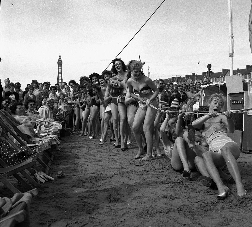 Sunday pictorial beach contest at Blackpool. Competitors take part in a game of tug o war, 1958