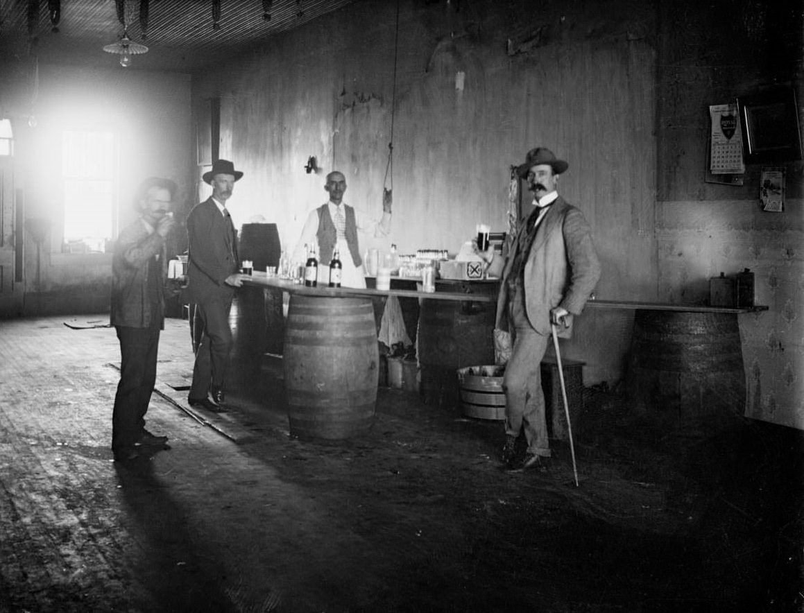 Four men drinking in a bar