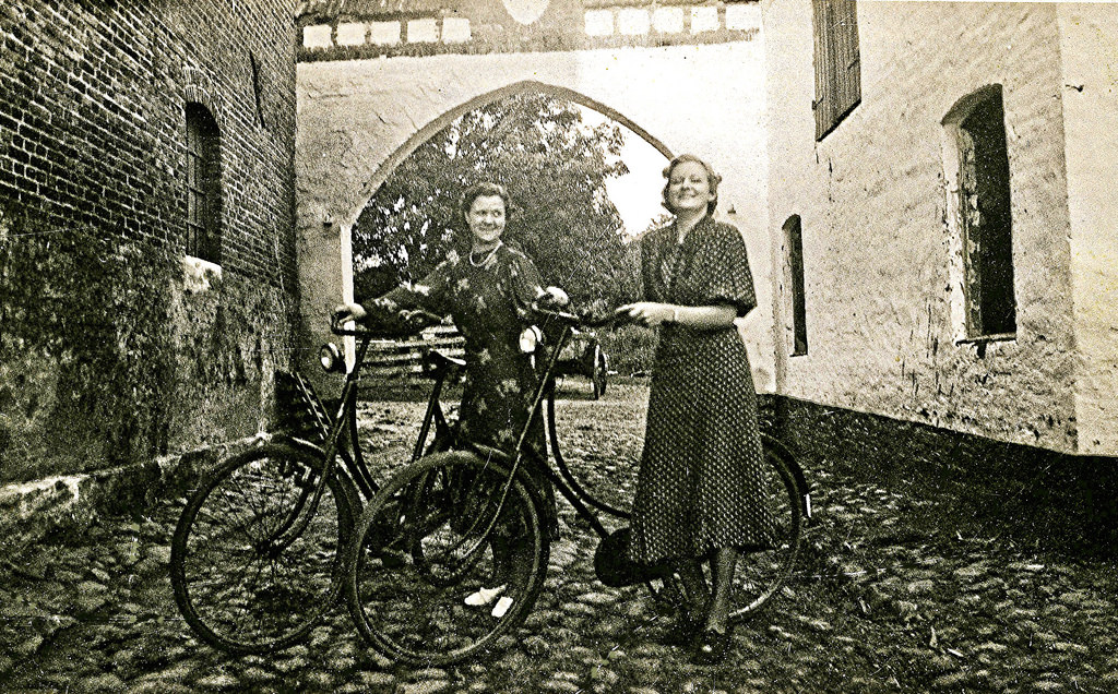 Women with bicycles in a farm in Denmark, 1937