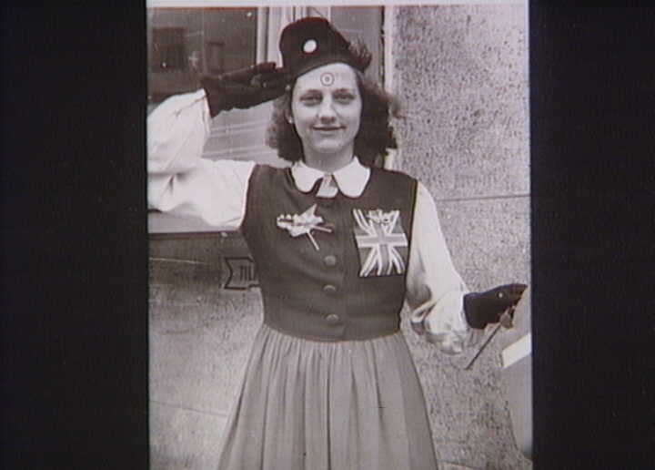 Woman with RAF badges and Dannebrog (the Danish flag). 5th May 1945.