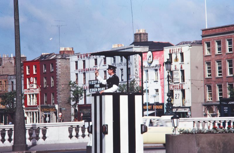 Garda directing traffic, O'Connell Bridge, Dublin, 1963