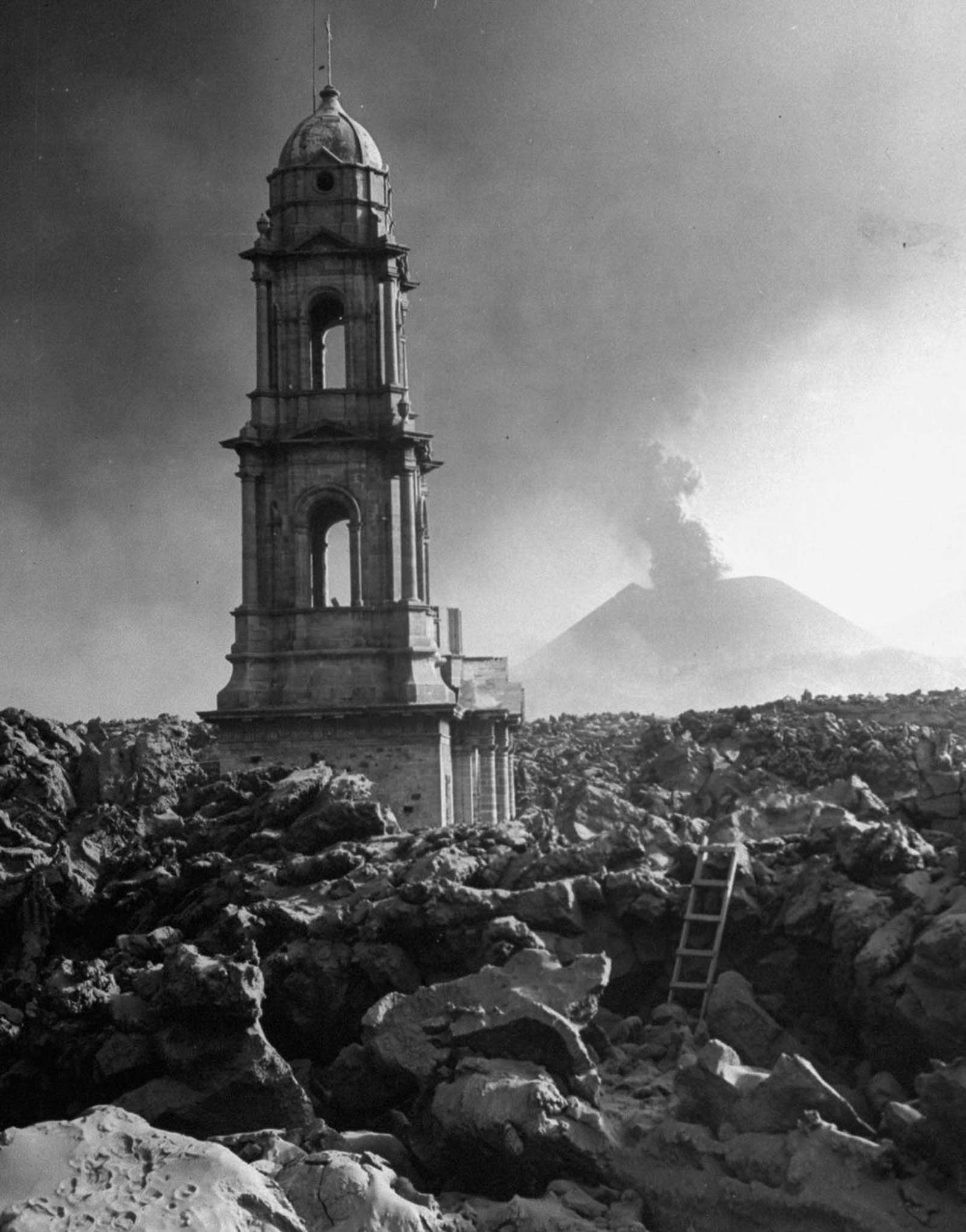The San Juan Parangaricutiro church tower rises above a lava field.