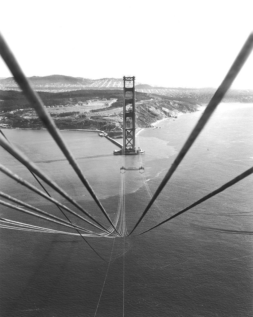 Cables suspended on the Golden Gate Bridge between the towers before being bound together to support the roadbed that will hang below them.