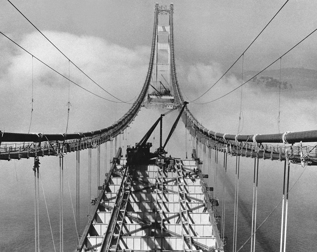 Setting roadbed sections in the fog during the construction of the Golden Gate Bridge, San Francisco, October 29, 1936.