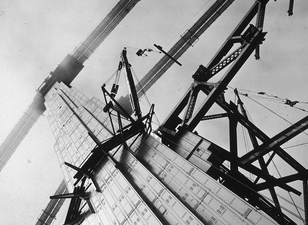 Construction workers attaching steel beams to the Golden Gate Bridge in San Francisco during its construction.
