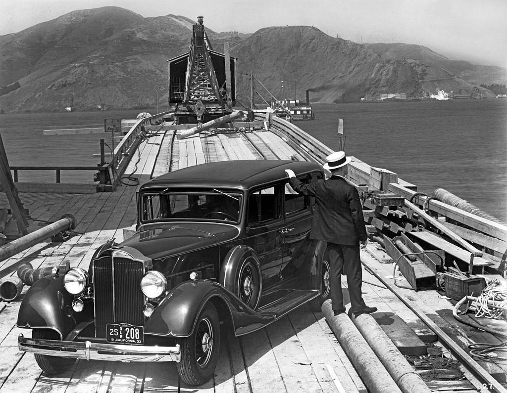 A man with a 1933 Packard on the trestle to the South Tower during the beginning of the construction of the Golden Gate Bridge