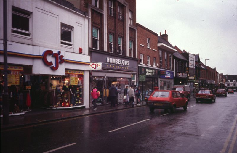 Looking south along the east side of Upper Brook St with the junction with Tacket St in the distance