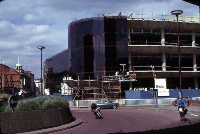 The glass cladding of the Willis Faber building is in progress