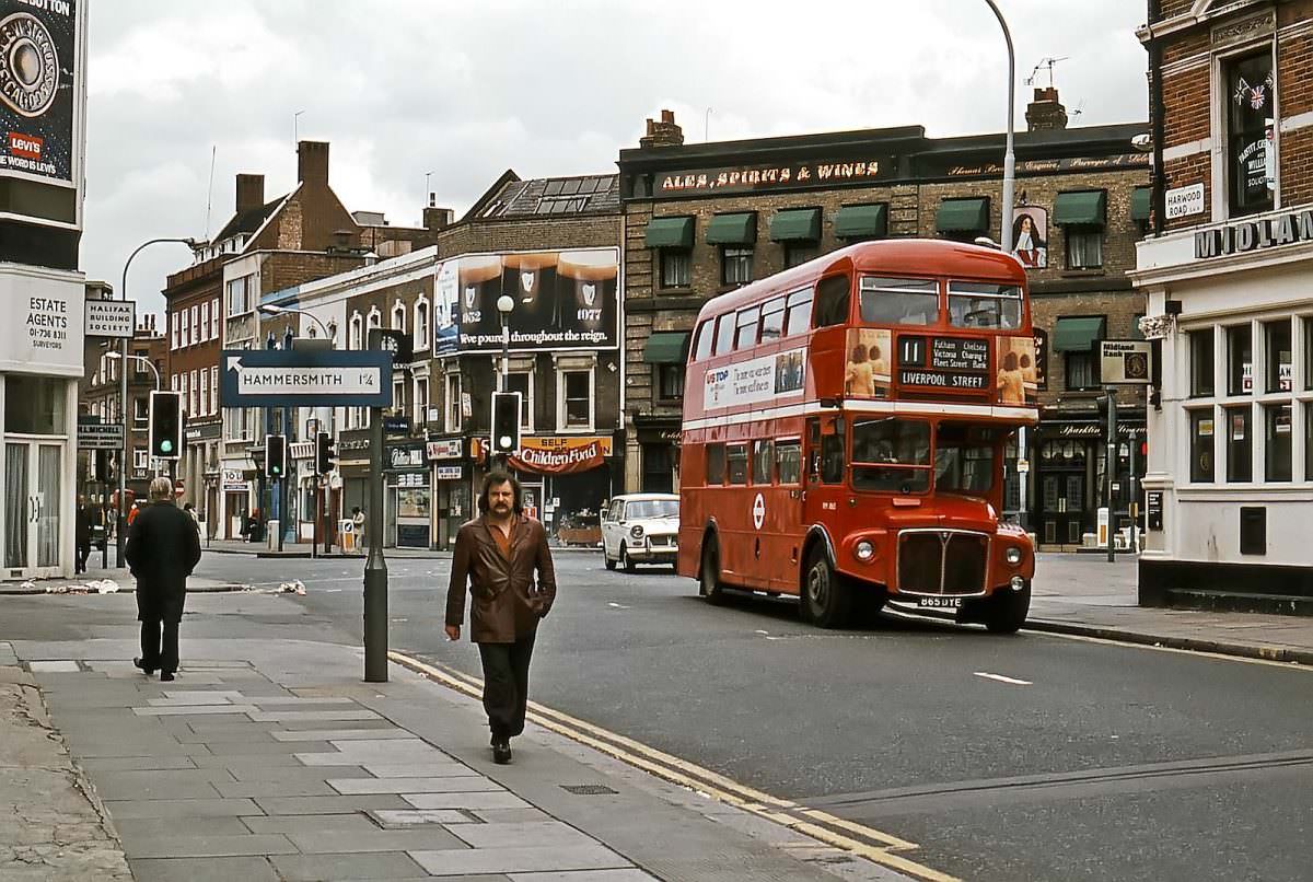 Turning from Fulham Broadway into Harwood Road, AEC Routemaster No. RM 1865 works route 11 on 7th June 1977.