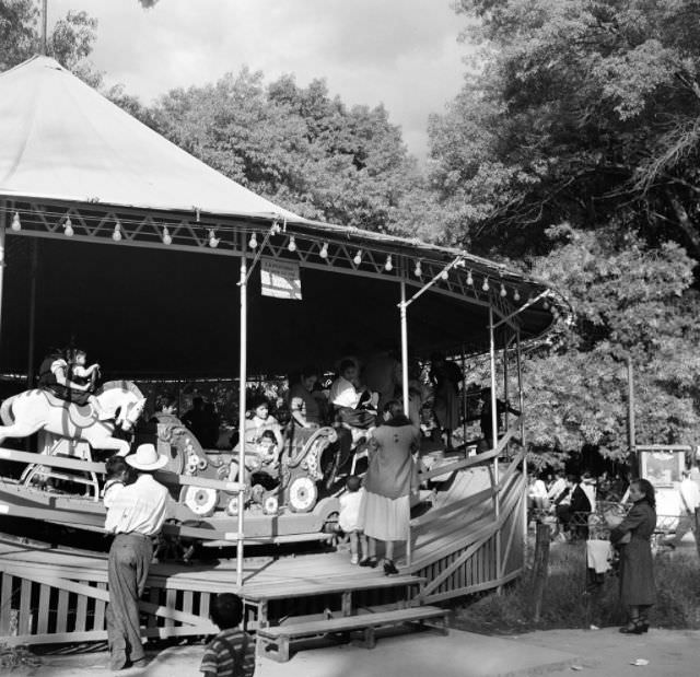 Locals ride a merry go round in Mexico City.