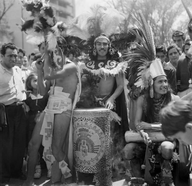 Locals dress in Aztec costumes in Mexico City.