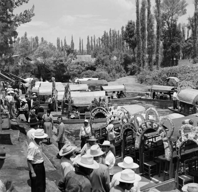 Boats along the canals take tourist on rides in Mexico City.