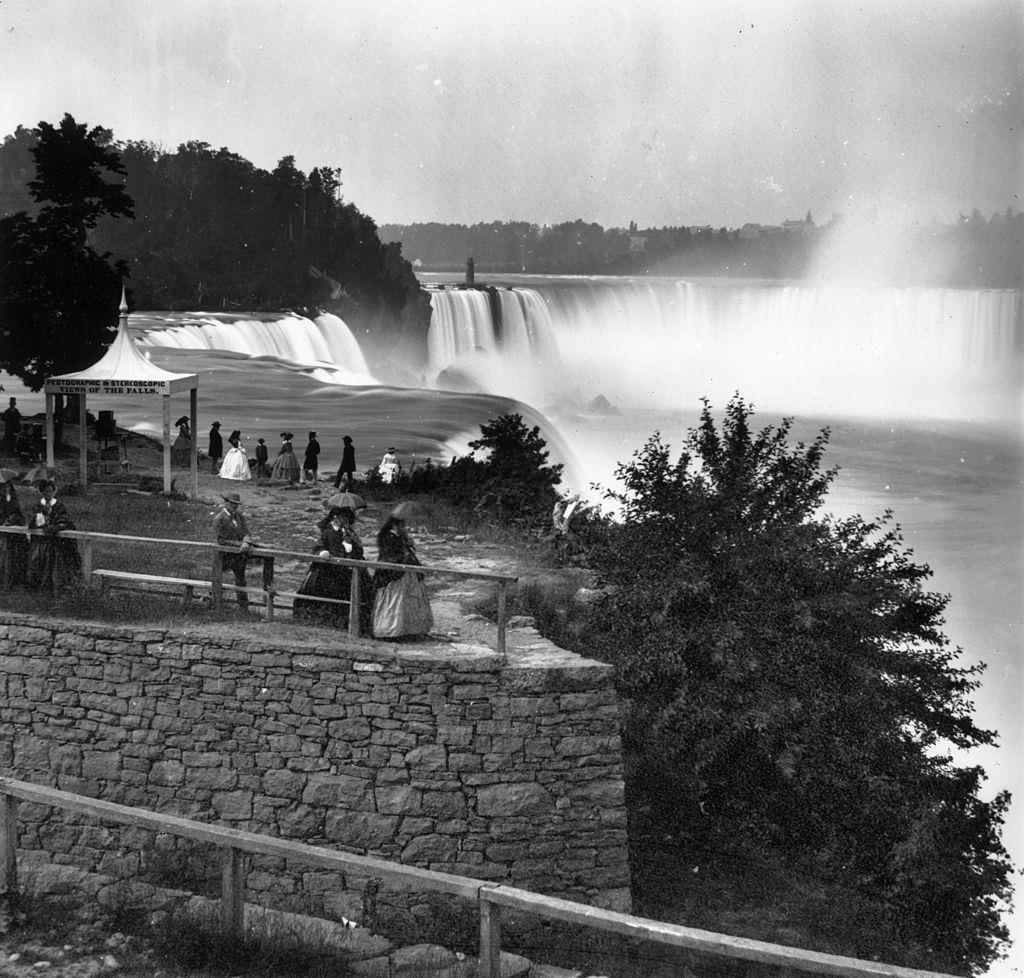 Visitors overlooking Niagara Falls from Prospect Point, on the US bank, 1859.