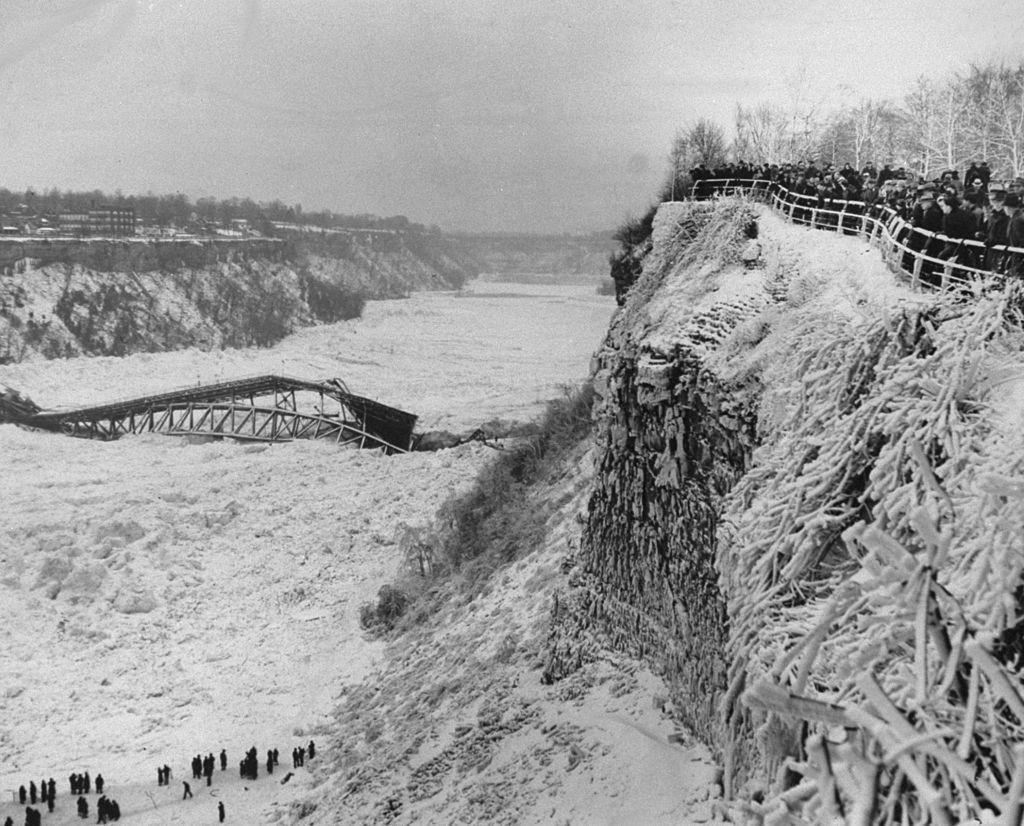 Crowd gathers to see the wreckage of the Falls View Bridge, 1938.