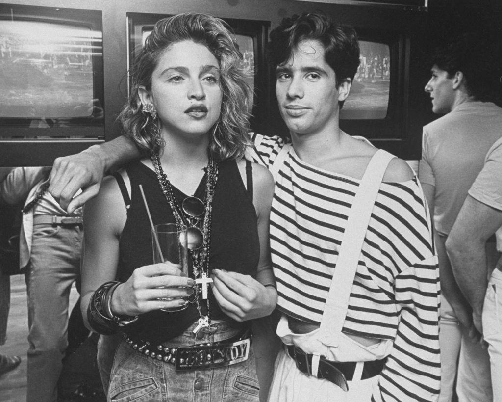 Madonna with D.J. Jellybean Benitez at opening of video club Private Eyes, 1984.