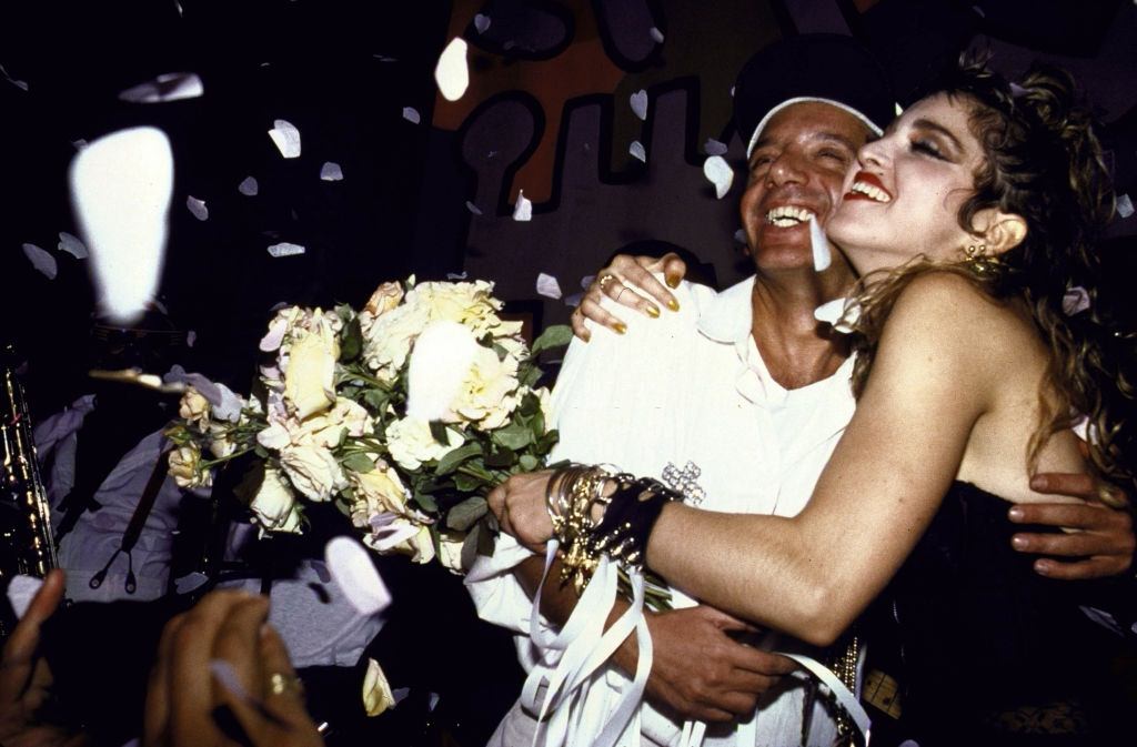 Madonna, holding flowers and hugging unident, 1985.