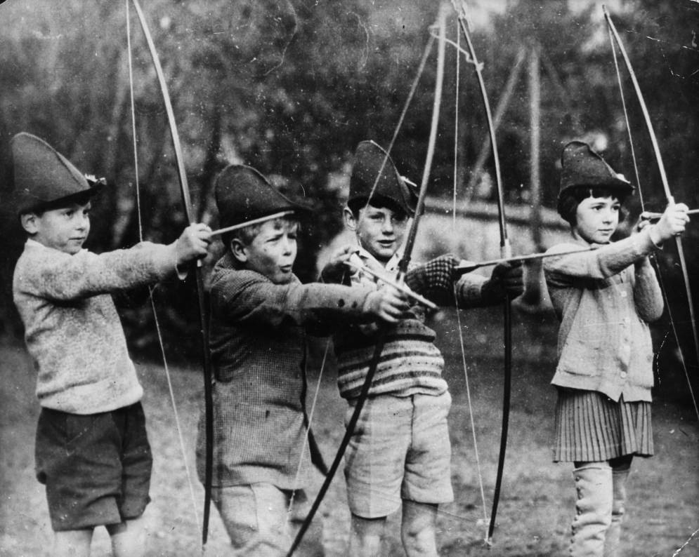 Philip of Greece (second from the left) trying his hand at archery with his schoolmates at the MacJannet American school in France, 1929.