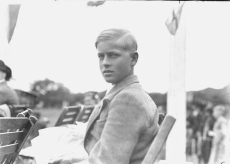 Philip sitting on a chair, He was 14-years-old.