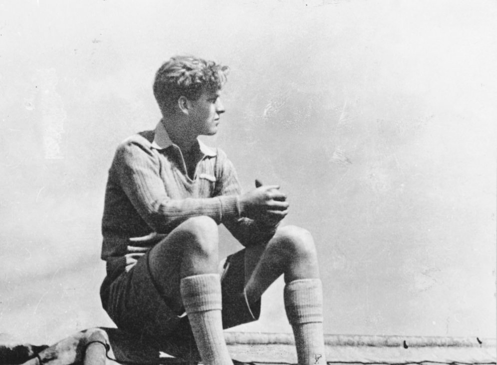 Philip sitting on the roof of Gordonstoun School, 1938.