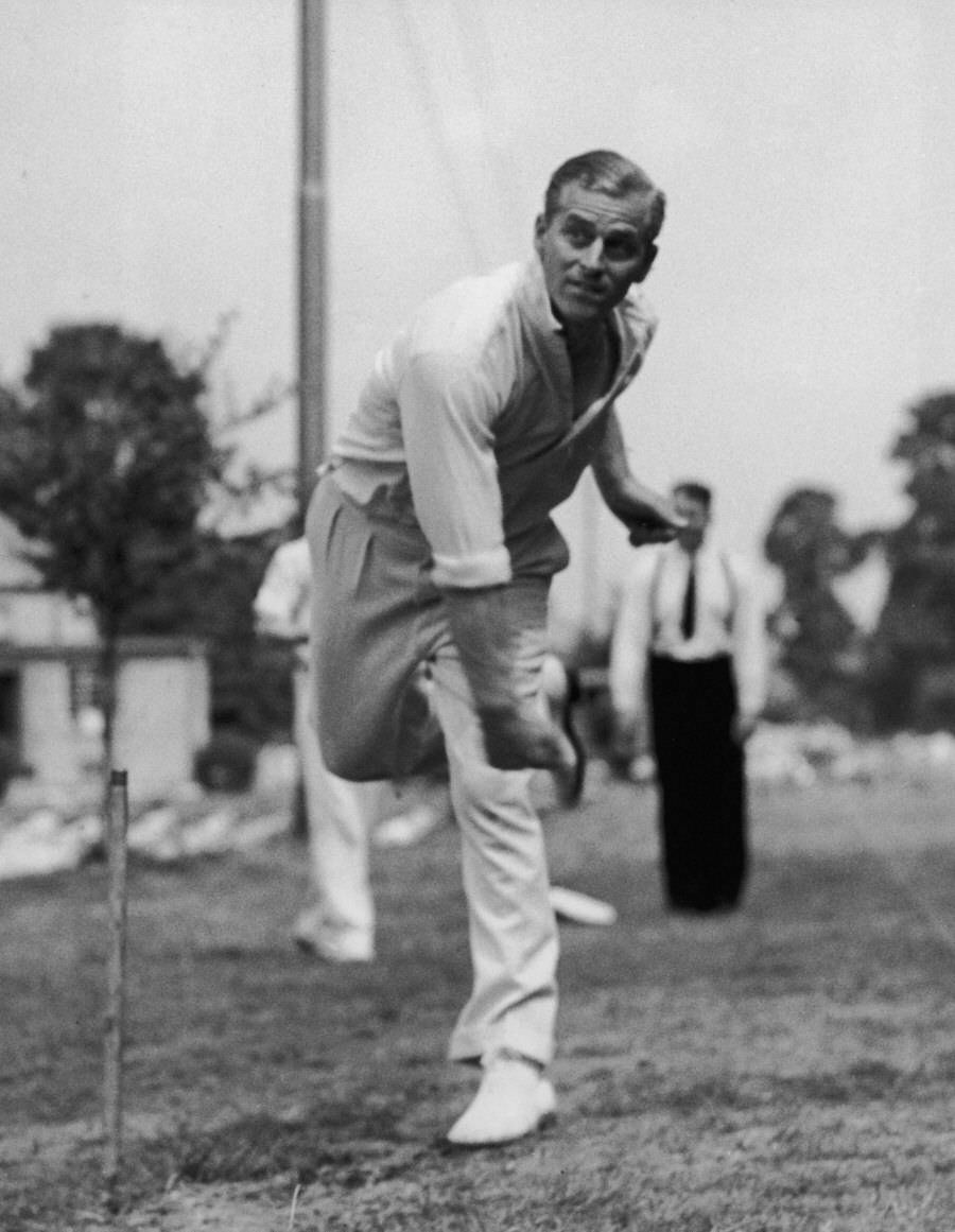 Prince Philip takes in cricket practice at the Petty Officer's Training Centre at Corsham, Wiltshire, 1947.