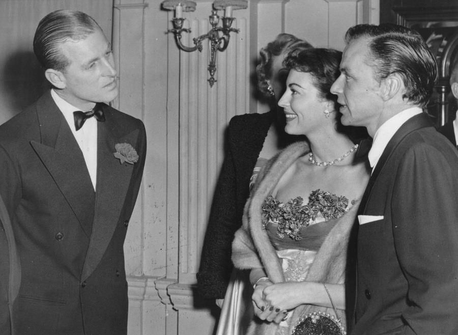 Prince Philip chats with Frank Sinatra and Ava Gardner at London's Empress Club, 1951.