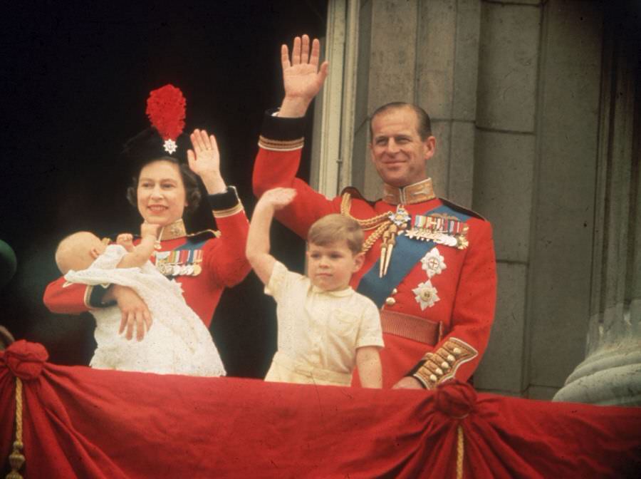 Prince Andrew and Prince Edward give a royal wave alongside their parents during the Trooping the Colour parade, 1964.