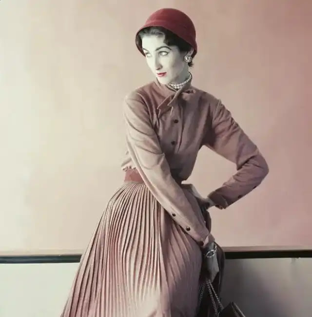 Model is wearing a wool jersey blouse and a slim pleated skirt, 1952