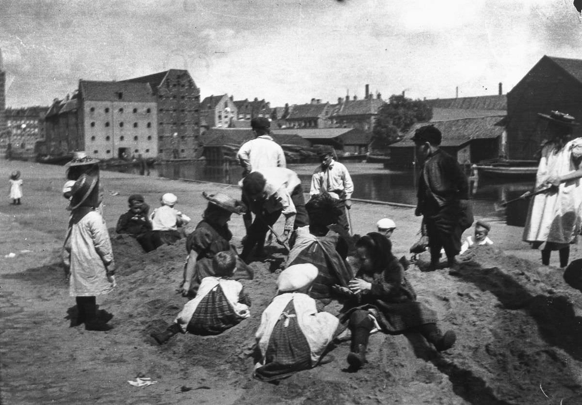 Children play in a sand dump near Prince Island.