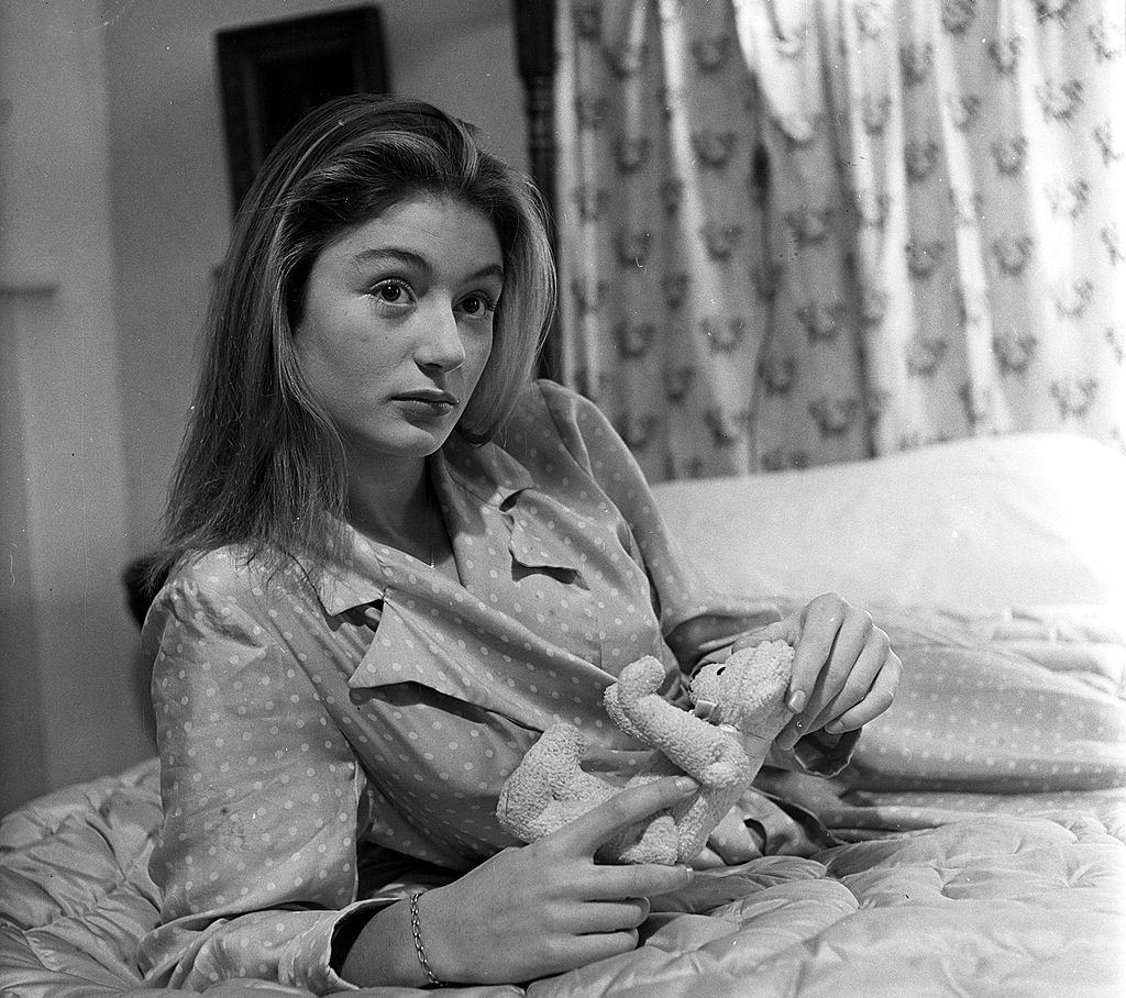 17-year-old Anouk Aimee holding a Teddy Bear, 1949.