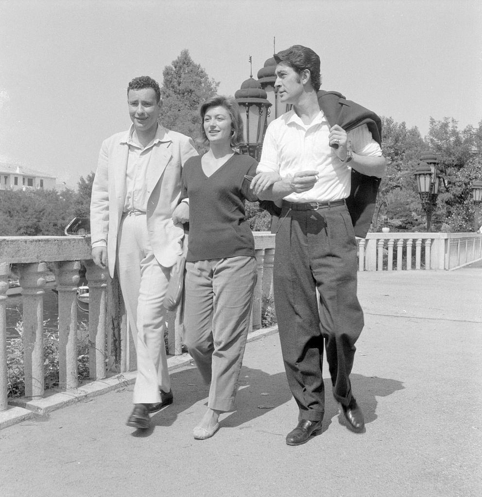 Anouk Aimee with Jean Claude Pascal walking together during the XVI Venice International Film Festival. Venice, 1955