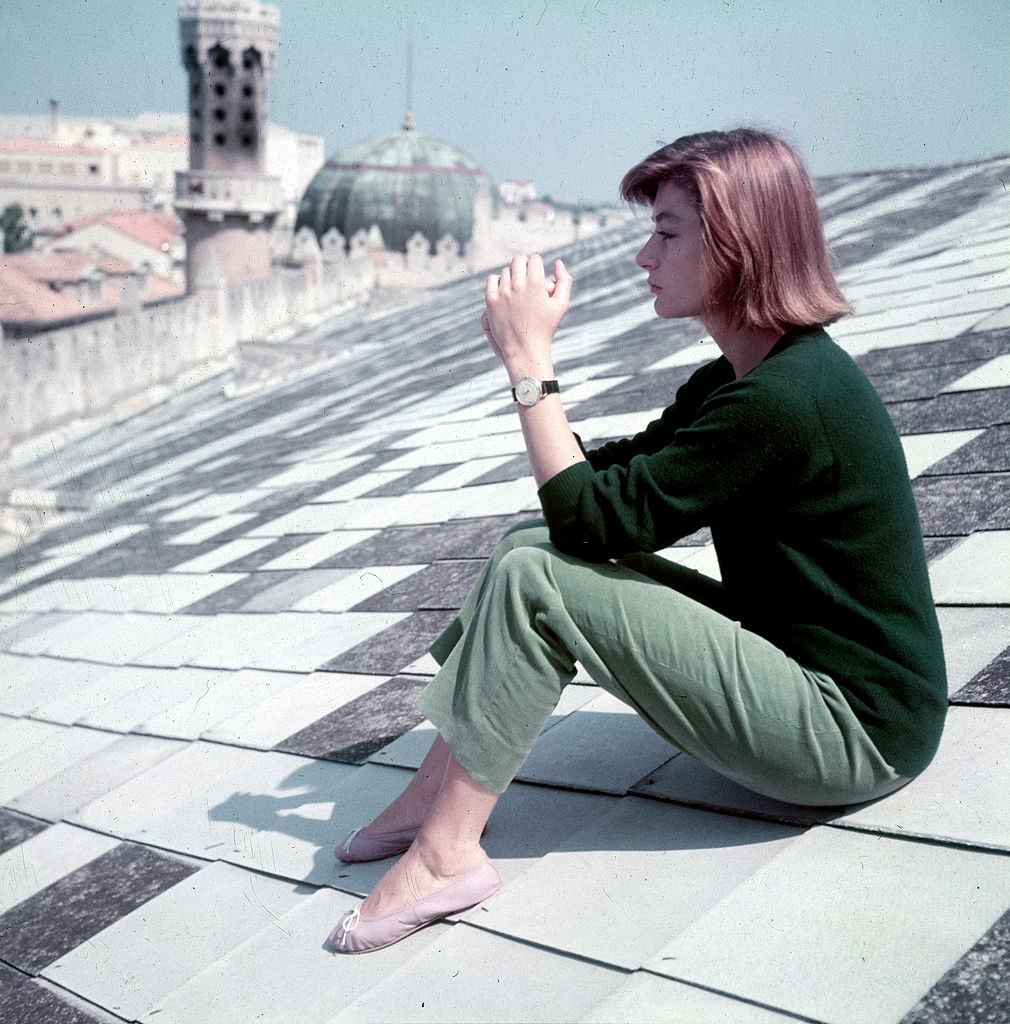 Anouk Aimee sitting on the Hotel Excelsior roof, 1955.