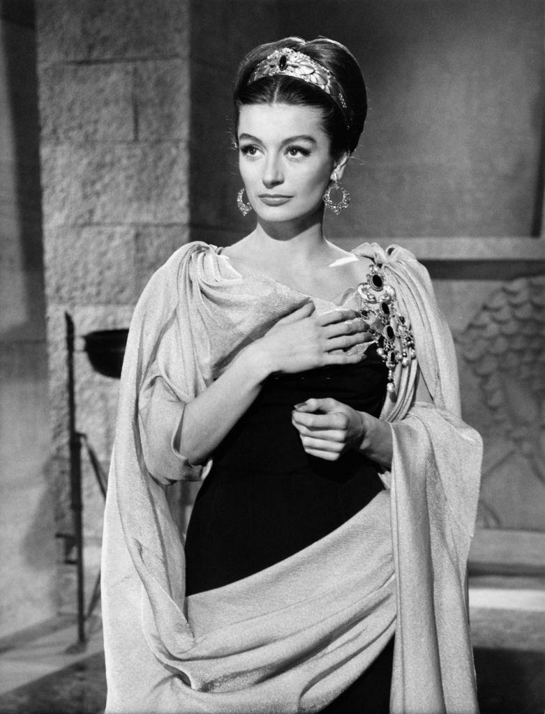 Anouk Aimee wearing a period costume, 1960.